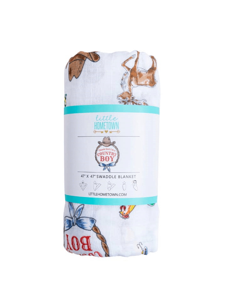 A white blanket with various animals on it.