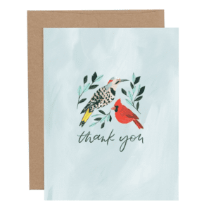 A card with birds and leaves on it