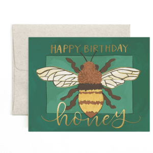 A birthday card with an image of a bee.