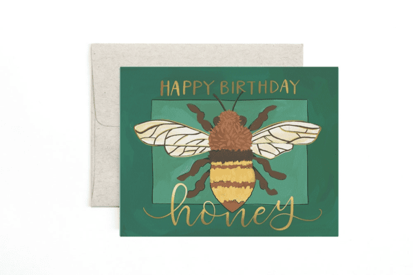 A birthday card with an image of a bee.