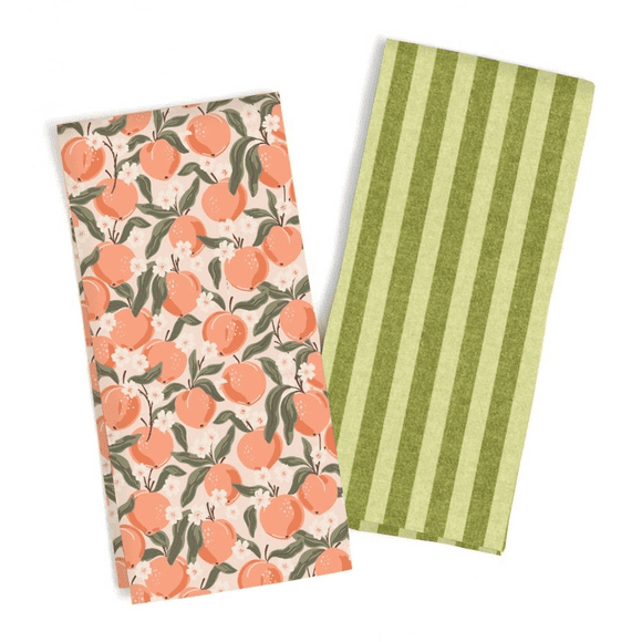 Two napkins with peaches and a green stripe.