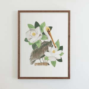 A framed picture of an ostrich and flowers.