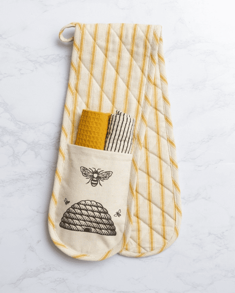 A pair of oven mitts with an image of bees on them.