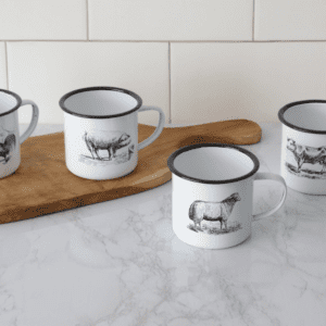 A group of four mugs sitting on top of a counter.