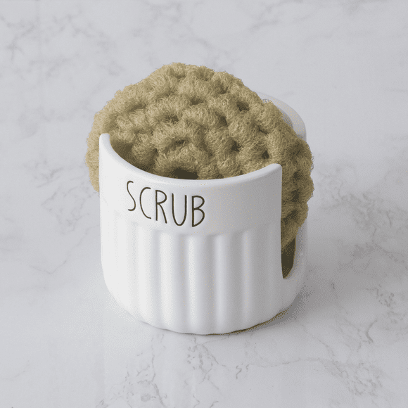 A white cup with a brown crocheted scrubby in it.