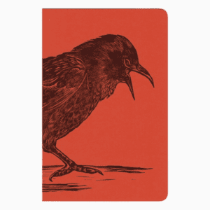 A red notebook with an illustration of a bird.