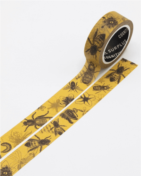 A roll of yellow tape with black bugs on it.