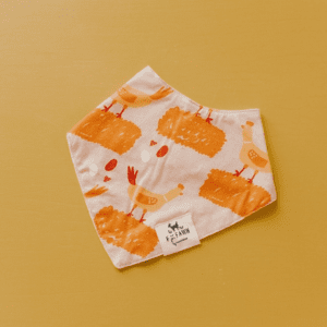 A white and orange bandana with candles on it.