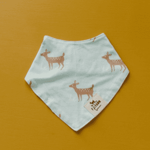 A blue bandana with brown deer on it