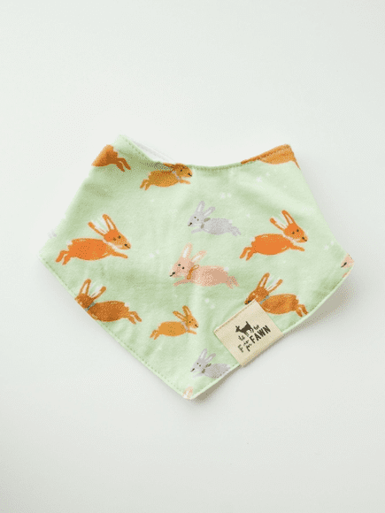 A green bandana with bunnies on it