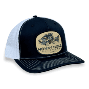 A black and white hat with a fish patch on it.