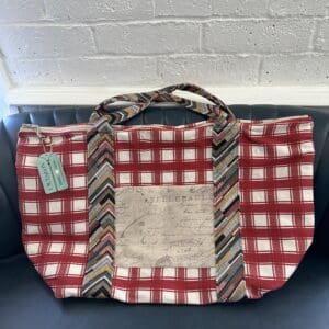 A red and white bag with a tie on it