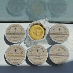 Four Red Hill Bee Farm beeswax lotion bars.