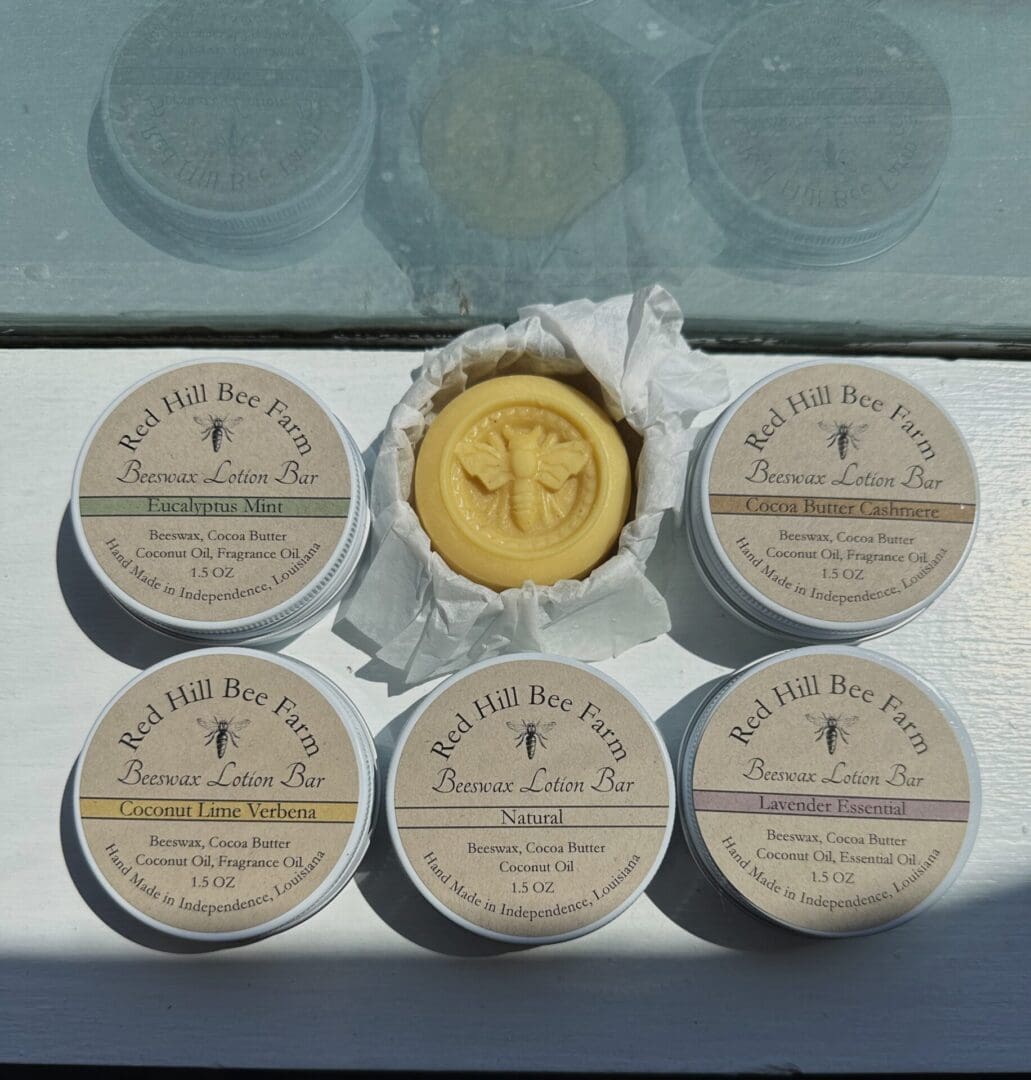 Four Red Hill Bee Farm beeswax lotion bars.