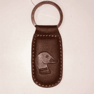 A brown leather key chain with an image of a duck.