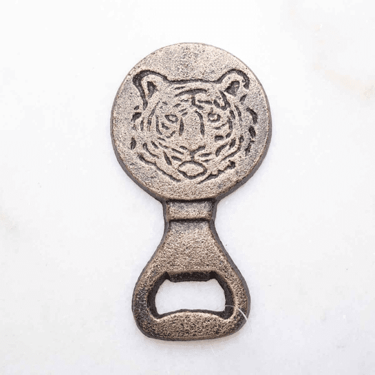 A bottle opener with an image of a tiger on it.