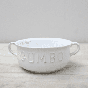 A white bowl with the word gumbo written on it.