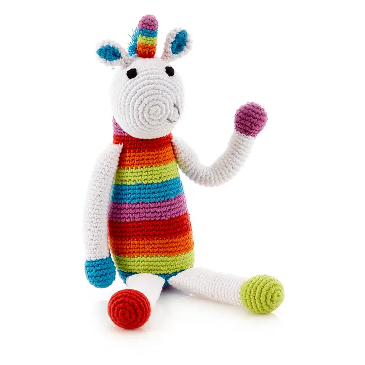 Rainbow striped crocheted unicorn toy.