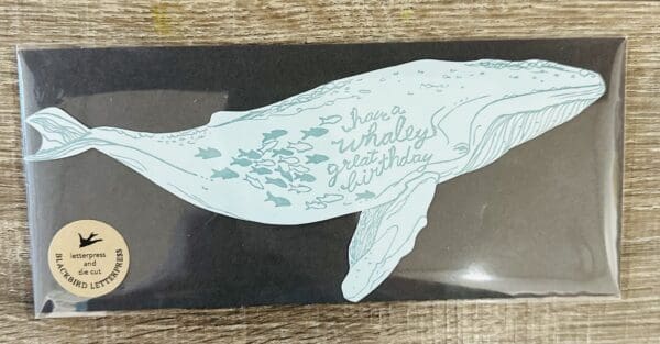 Blue whale birthday card with fish.