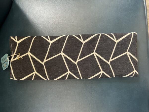 Black and white geometric patterned cushion.