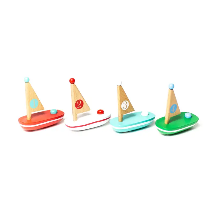 Four wooden toy sailboats numbered 1-3.