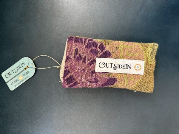 Floral patterned pouch with "Outsidein" label.