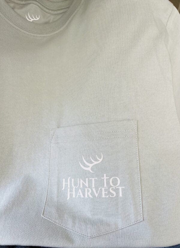 Light green t-shirt with "Hunt to Harvest" logo.