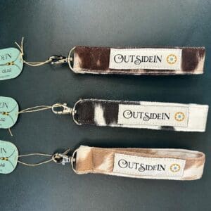 Three cowhide keychain straps with "OutsiDein" logo.