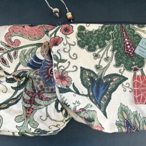 Floral patterned travel bag with zipper.