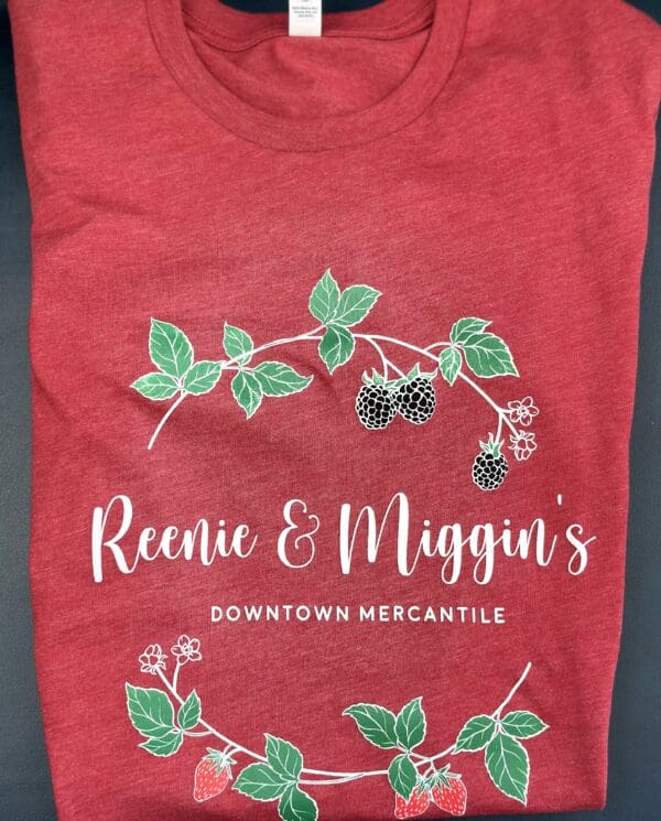 Red t-shirt with Reenie & Miggin's logo.