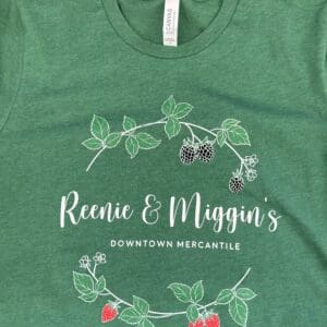 Green t-shirt with Reenie & Miggin's logo.