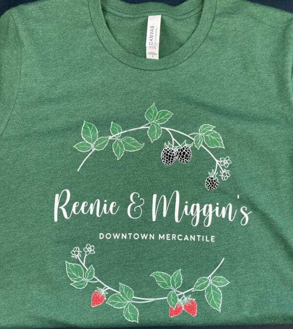 Green t-shirt with Reenie & Miggin's logo.