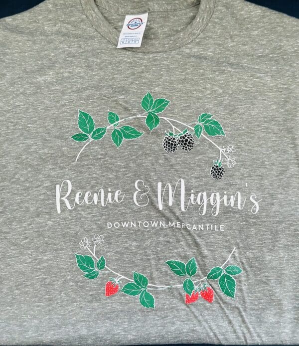 Grey t-shirt with "Reenie & Miggin's" logo.