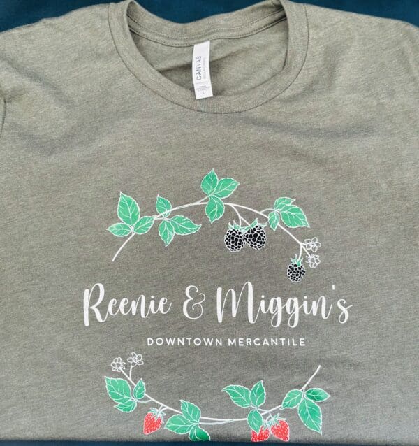 Green shirt with Reenie & Miggin's logo.