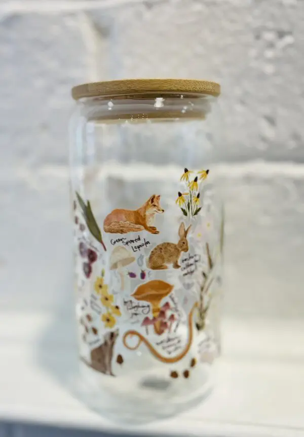 Forest animal and floral glass jar.